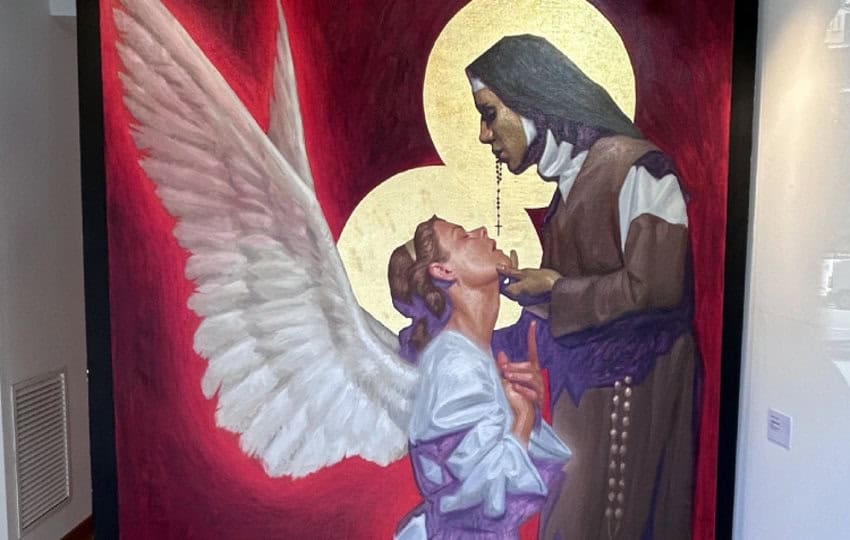 Painting of a nun in habit holding the chin of a kneeling angel all in white. They are painted against a blood-red background. The painting is titled