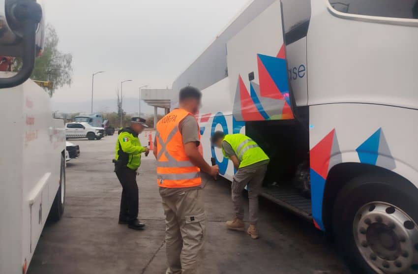 Authorities inspecting bus cargo hold
