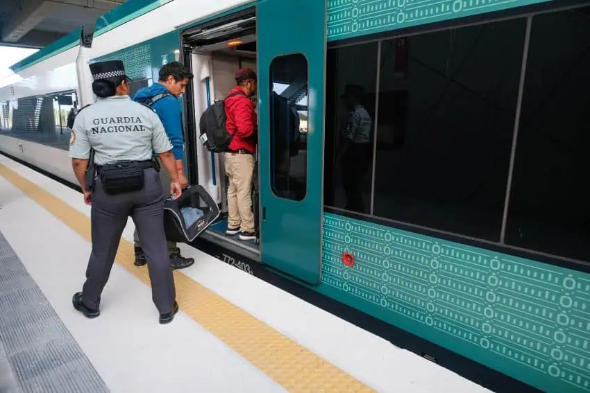 Passengers boarding a Maya Train car