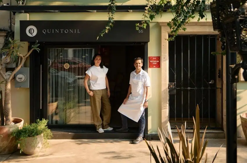 Two people in front of a restaurant