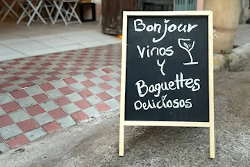 A billboard outside an open restaurant