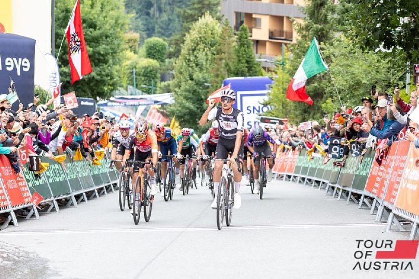 Cyclist Isaac del Toro crosses the finish line at a race in Austria