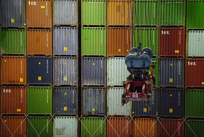 A wall of import/export shipping containers