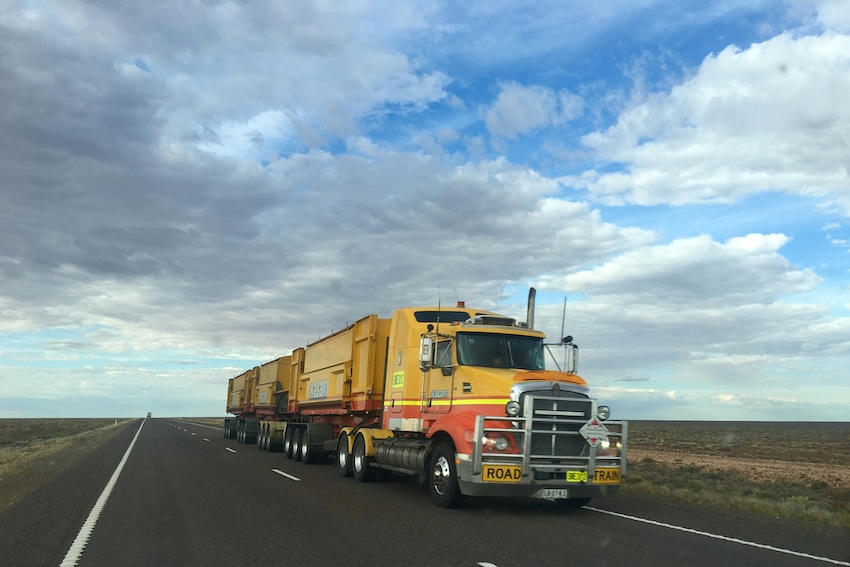 a heavy-duty truck going down the highway