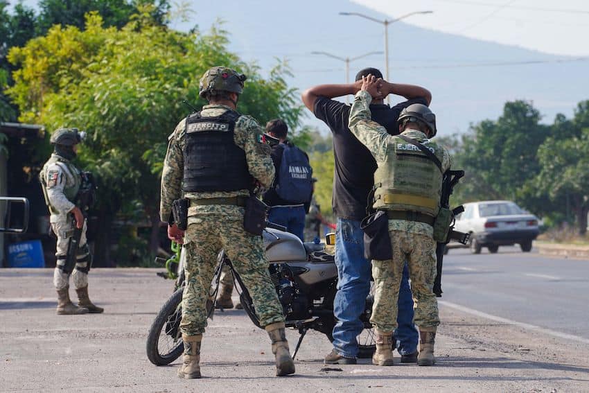 a person being detained by Mexican authorities