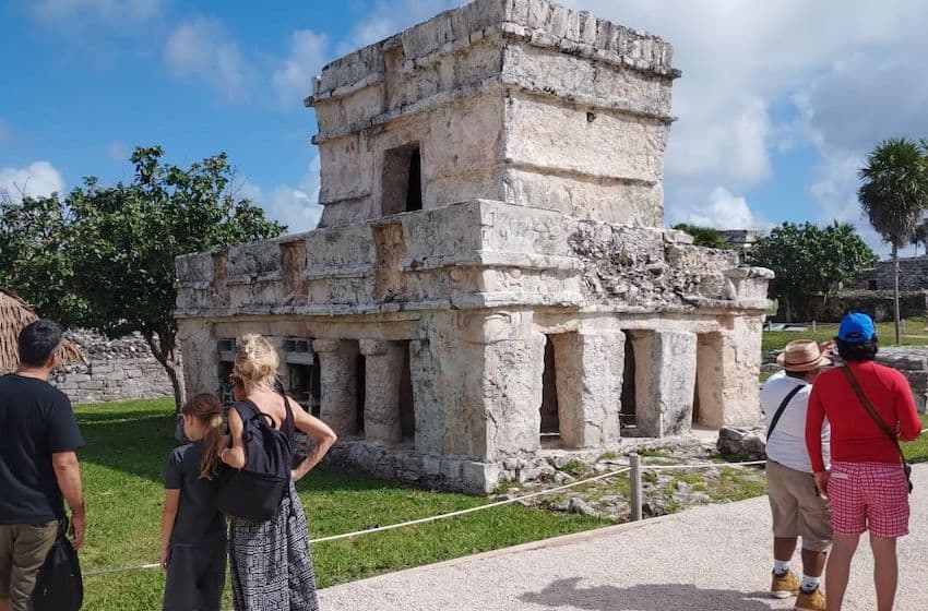 tourists observing ruins in Mexico